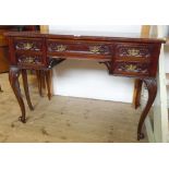 A 3' 3" 19th Century stained walnut kneehole writing table with brown leather inset top, single