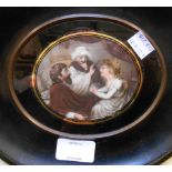 A late 18th Century/early 19th Century wide ebonised framed oval miniature painting of two men and a