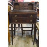 A 21 1/2" reproduction mahogany bonheur du jour with three central drawers, flanking recesses and