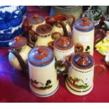 Eight Torquay Pottery cottage motto ware hot water jugs, Watcombe and Aller Vale - one lid