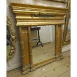 A 3' 2" neo-classical style gilt framed wall mirror with wide moulded cornice and twin flanking half