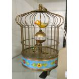 A reproduction champlevé enamelled automaton bird cage alarm clock