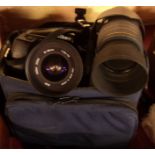 A Nikon F70 SLR camera and accessories, including macro lens, etc. - contained in soft case