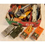 A box containing a collection of vintage metal toy lorries, trucks and other vehicles including