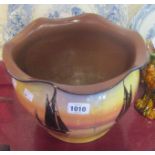 A 11" diameter Watcombe Pottery jardinière with frilled rim and sail boat decoration - crack to rim