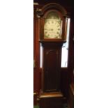 A antique mahogany and oak longcase clock with 11" painted arch dial, marked for J. Bailes,