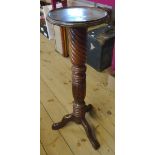 A Victorian mahogany jardinière stand, set on decorative rope twist, ring turned and acanthus pillar