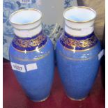 A pair of 10" Royal Doulton baluster vases with white and navy blue collars, gilt highlighting and