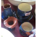 Six pieces of Torquay pottery kingfisher ware comprising two vases, three dishes and a pot