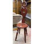 A reproduction Victorian style spinning chair bearing plaque stating "Made with wood from the pulpit