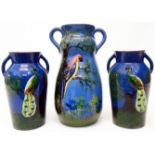 A pair of Royal Torquay peacock pattern vases - sold with a parrot design vase