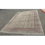 A large Lahore Carpet Manufacturing Co. Bokhara elephant gul carpet with multi border featuring