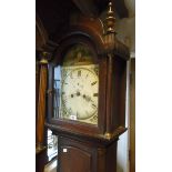 A 19th Century stained oak longcase clock 11" painted arched dial indistinctly mark for F. Barnes,