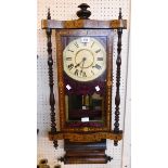 A 35" 19th Century ornate inlaid rosewood cased wall clock with finials to top, flanking slender