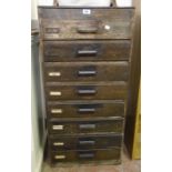 A 20" vintage stained wood flight of eight office drawers