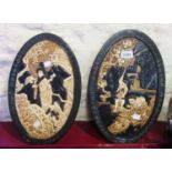 A pair of 15 1/2" Bretby oval wall plaques decorated with Oriental scenes