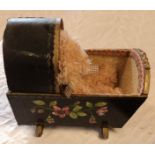 A dolls rocking cradle with painted and applied floral decoration - sold with a Russ Briarton
