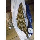 A quantity of brass stair rods and clips