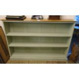 A 4' 7" part painted three shelf open bookcase, set on plinth base