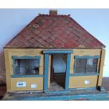 A vintage doll's bungalow with tiled roof - ripe for improvement