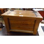 A 17" 20th Century wooden lift-top work box with iron strap hinges and ring handles