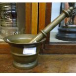 A turned bronze pestle and associated bell metal mortar