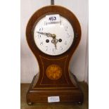 An Edwardian inlaid mahogany cased balloon shaped mantle clock with French eight day gong striking