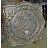 A 20" diameter Islamic copper-bronze alloy flower head shaped tray with pierced decoration