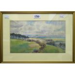 A gilt framed watercolour depicting a coastal view at Lyme Bay
