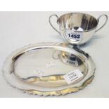 A silver two handled sugar bowl - Sheffield 1935 - sold with silver oval stand with shaped rim -