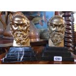 A pair of hollow cast bronze alloy busts depicting a bearded man, set on black marble stepped