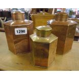 A pair of copper tea caddies, marked for JH to base - sold with a smaller brass caddy