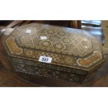 A 14 1/2" Persian octagonal trinket box with khatam mosaic inlay enclosing a material lined interior