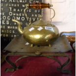 A brass squat kettle with amber glass handle - sold with a bras and wrought iron stand