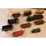 A box containing a collection of vintage O gauge Hornby engines and rolling stock including Great