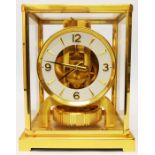 A Jaeger Le Coultre brass and glass cased ATMOS Classic mantel clock in original box with all