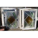 A set of ten Art Deco leaded and coloured light glass windows, mostly framed