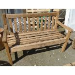 A 4' slatted wood two seater garden bench