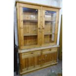 A 4' 8" modern waxed pine Bo Skan Denmark "Sammierschrank" two part unit with glazed top section