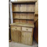 A 3' 6" Victorian pine dresser with two shelf open plate rack over two short drawers and pair of