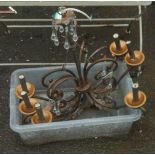 An iron electrolier with decorative glass drops