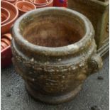 A garden Classical style planter with scroll handles