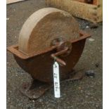 A late 19th Century hand operated grind stone with cast iron bracket