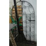 A 33" wide wrought iron garden gate