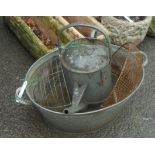 A galvanized watering can - sold with a galvanized bath tub, etc.