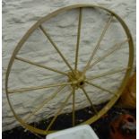 A painted metal cart wheel