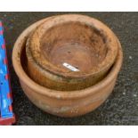 Two large terracotta garden pots and a smaller bowl