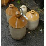 Three stoneware jars and a hot water bottle