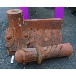 A Victorian terracotta roof ridge tile with finial