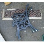 A pair of cast iron bench ends - sold with an associated lattice work back rest